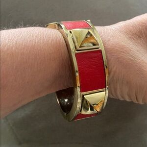 SPIKED bracelet WITH NON-FUNCTIONAL BOTTLE OPENER DESIGN